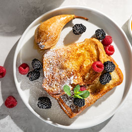 French toast with glazed pear and berries