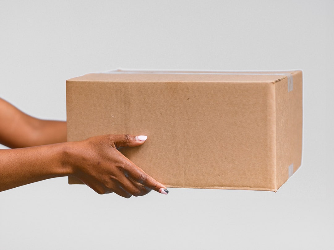 Women's hands holding a parcel