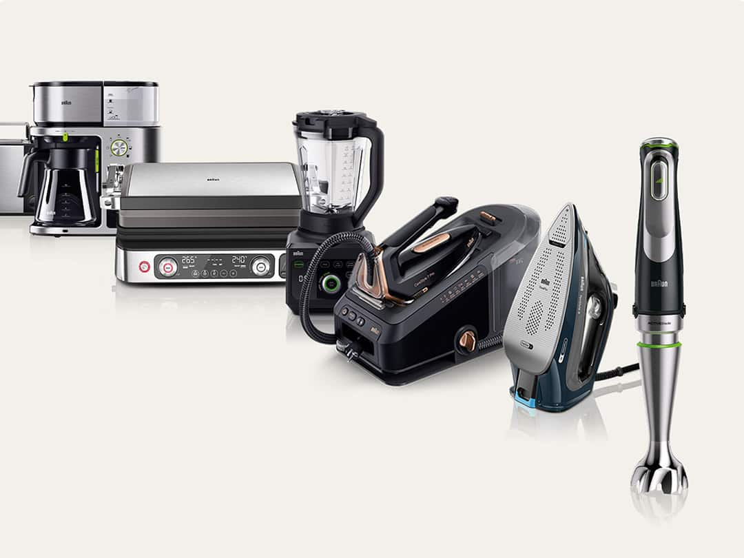 The Braun Household product range showing Hand blender,  Steam iron, Steam generator iron, Jug blender, Grill, coffee machine and toaster from front to back.