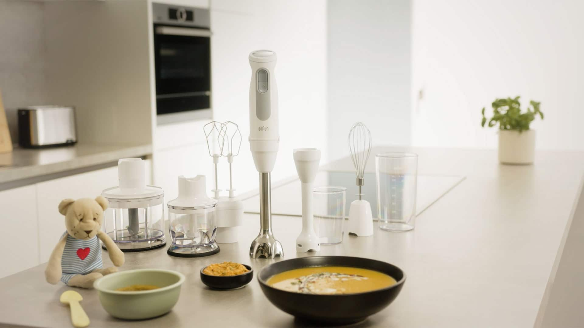 Lifestyle image of the Braun MultiQuick 5 Hand blender in white with all available attachments