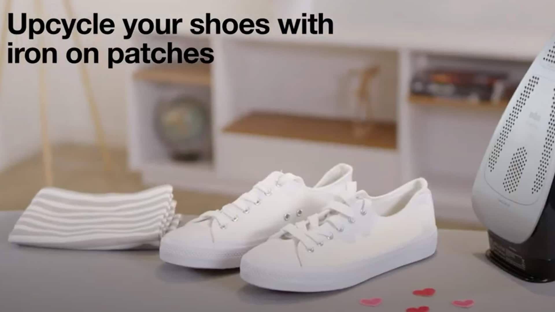 White sneakers standing on a craftig table, ready to get upcycled by iron on patches